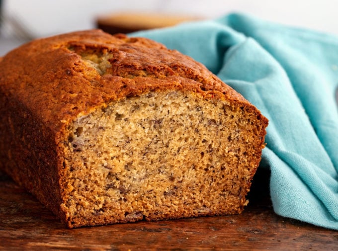 This Classic Banana Bread is ultra moist and tender, and a fantastic way to use up extra bananas!  Made with no mixer, in 1 bowl, and ready in 1 hour... it's the perfect easy quick bread recipe! #banana #bananabread #baking #bread #quickbread #loaf #easyrecipe #dessert