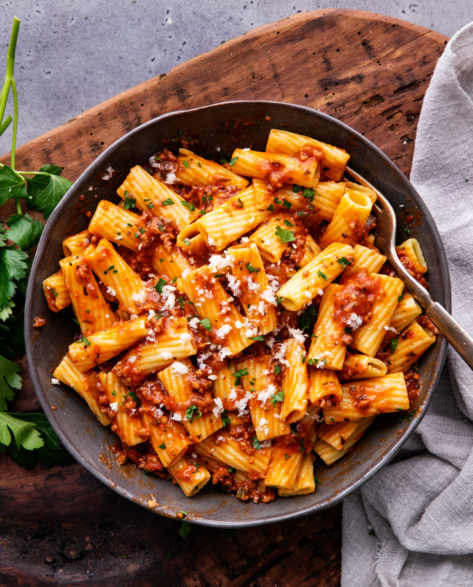 This Bolognese sauce recipe is hearty, rich and bursting with complex layers of flavor, and is on the table in 1 hour (instead of 2-3) thanks to the Instant Pot!  Pressure cook your way to an amazing Italian-style meal! #bolognese #meatsauce #spaghetti #italian #pasta #tomato #instantpot #pressurecooker #simmered