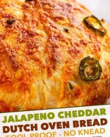 Jalapeno Cheddar Dutch Oven Bread is perfectly crusty on the outside, with a soft fluffy inside, and is made using simple ingredients. Deliciously savory with a bit of spice - perfect with a pat of butter, or for grilled cheese! #bread #homemade #dutchoven #baking #jalapeno #cheddar #pantry #noknead #baked #artisan