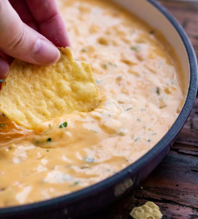 Dipping a chip into cheese dip