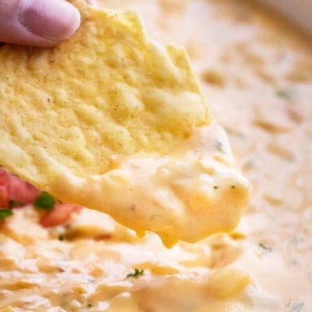 Smooth and silky queso dip, made using NO velveeta!  Packed with flavor, yet so easy to make, and party ready in just 20 minutes! #queso #dip #cheese #mexican #appetizer #party #cincodemayo #easyrecipe