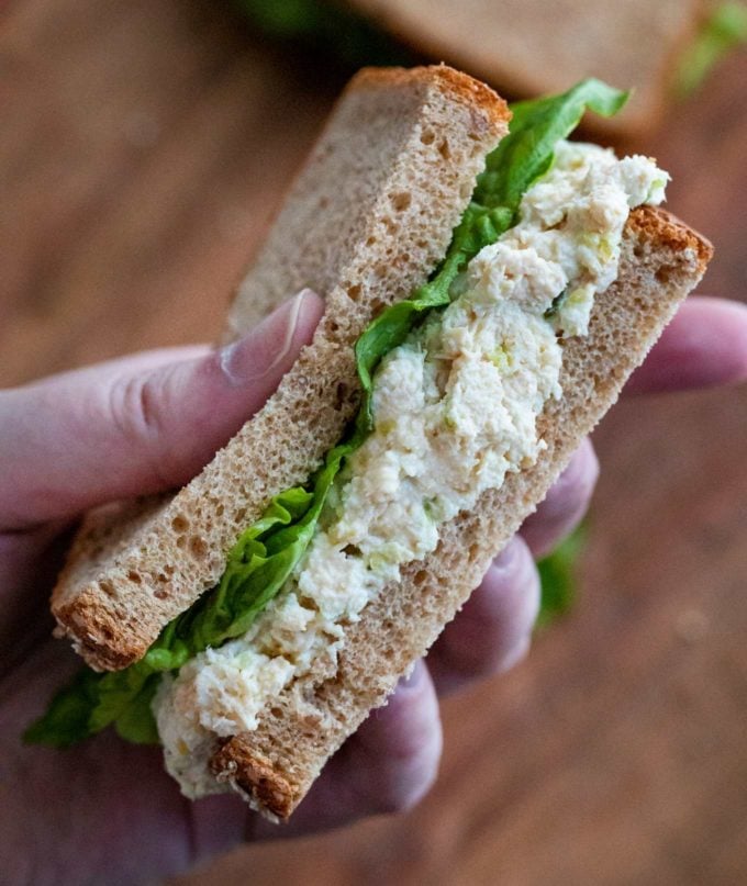 Holding a chicken salad sandwich