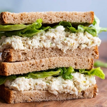 two halves of chicken salad sandwich, stacked on top of each other