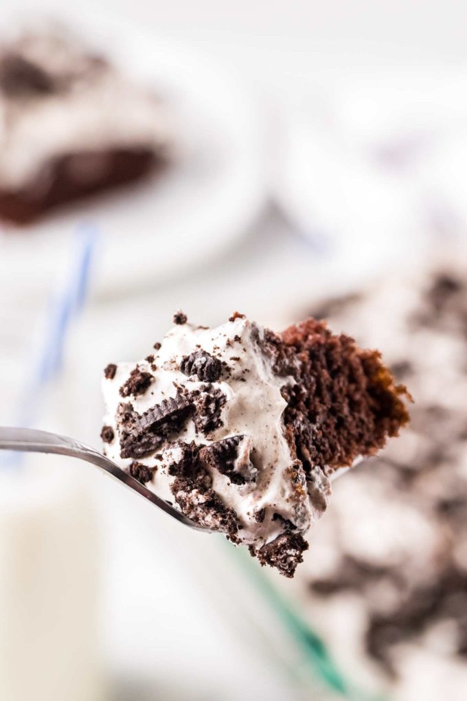 forkful of oreo poke cake