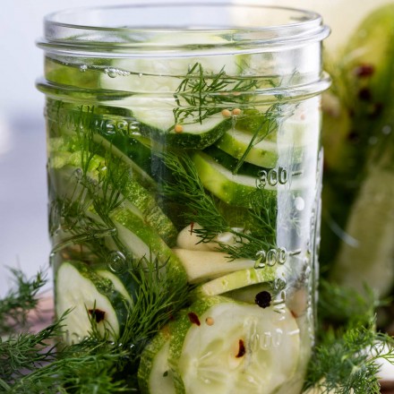 jar of dill pickles with brine