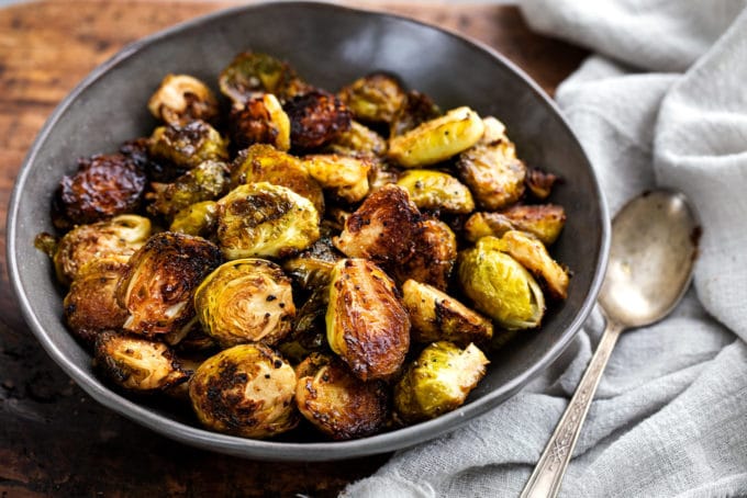 bowl of brussels sprouts with napkin and spoon