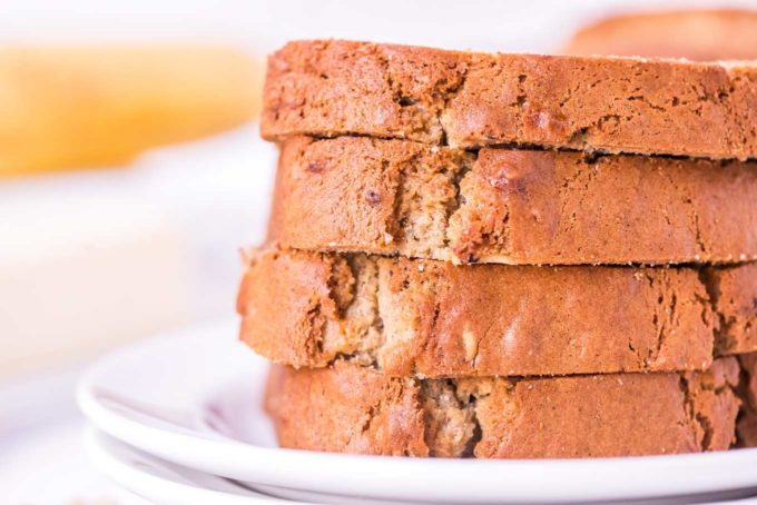 slices of banana bread stacked on white plate