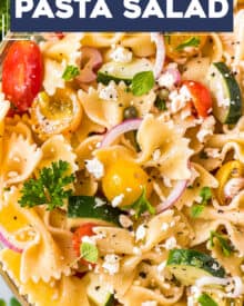 Always a crowd-pleaser, this Pasta Salad has won first place in several potluck contests.  Summer vegetables, tender pasta, salty cheese, and a mouthwatering zesty dressing!