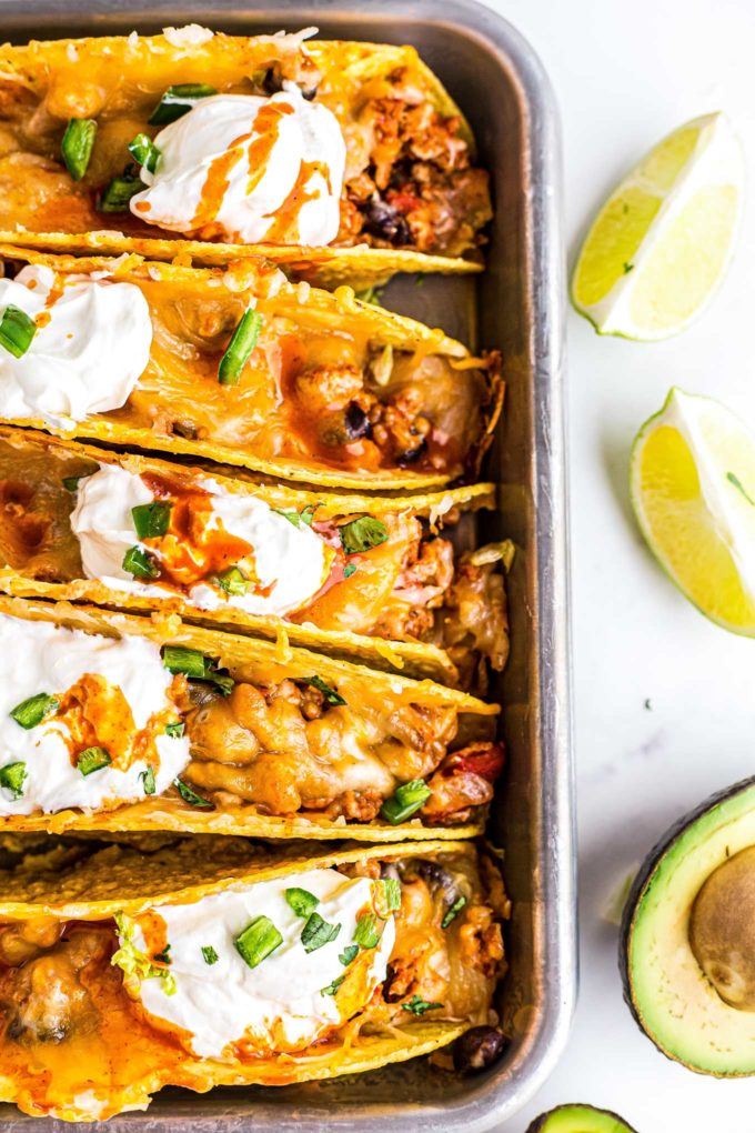 baked chicken tacos in baking dish overhead view