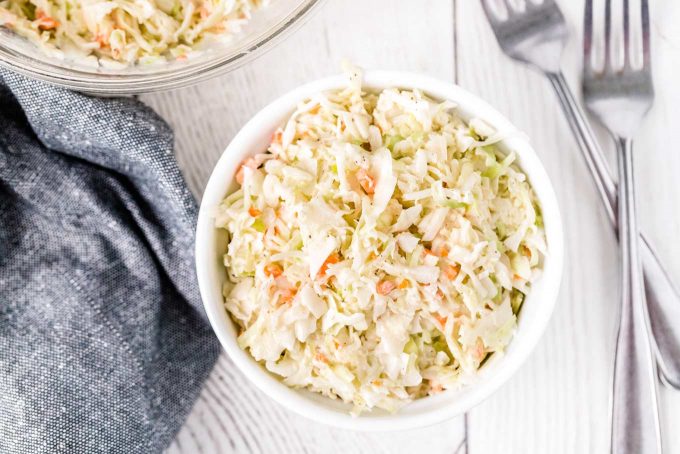 Classic and easy Coleslaw Recipe, made with crisp cabbage and carrots in a creamy, tangy and sweet homemade dressing! Recipe straight from the restaurant, it's the perfect summer side dish! #coleslaw #slaw #chickfila #copycat #copycatrecipe #easyrecipe #sidedish #side #summer #bbq