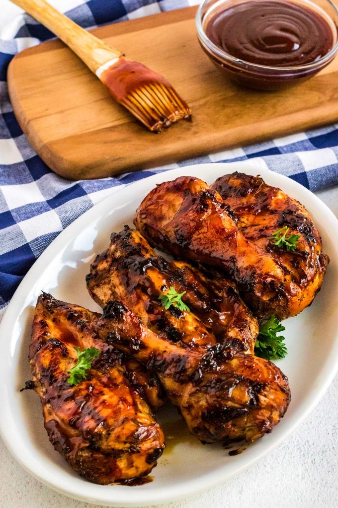 bbq chicken on white oval plate