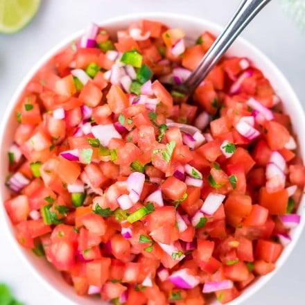 bowl of pico de gallo with spoon