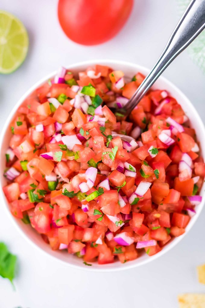 bowl of pico de gallo with spoon