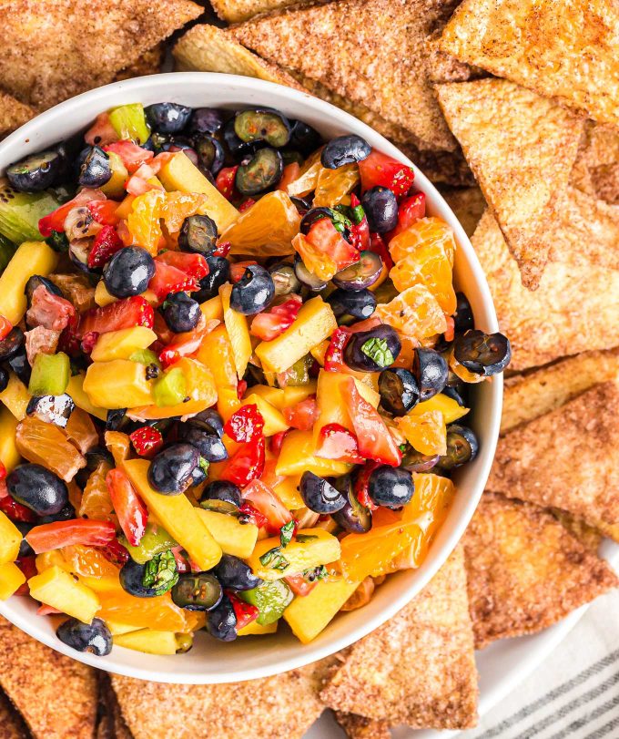 bowl of fruit salsa surrounded by cinnamon chips