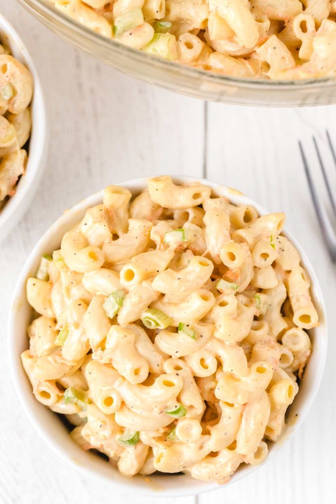 Sweet, tangy, and creamy... with just the right amount of crunch, this Hawaiian Macaroni Salad will become your GO TO macaroni salad recipe for every potluck and summer bbq! #macaronisalad #macaronisaladrecipe #hawaiianmacaronisalad #pastasalad #pastasaladrecipes #sidedish #sidedishrecipes #summerbbq #potluck