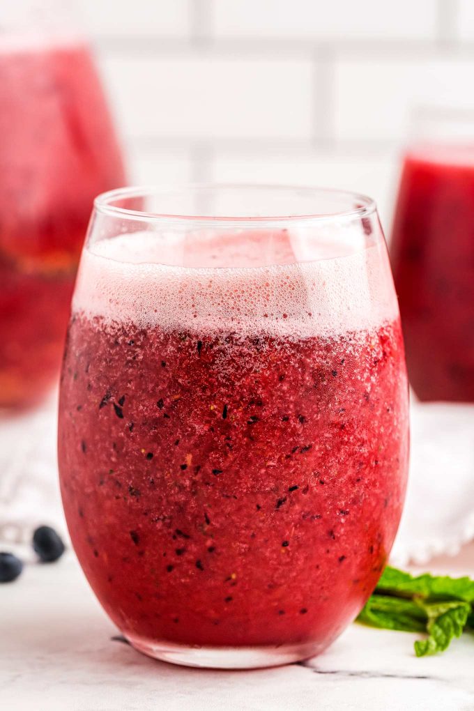 Delicious and refreshing fizzy fruit punch that is great for any party.  Uses just 4 ingredients, and is easy to make alcoholic if you want! #punch #fruit #mixedberry #berry #party #drink #beverage #summer 