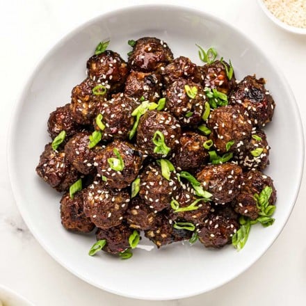 bowl of thai meatballs with green onions