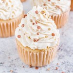 Group of vanilla cupcakes with rose gold sprinkles