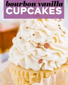 These Bourbon Vanilla Cupcakes are perfectly moist, and completely irresistible!  Light and fluffy cupcakes are spiked with bourbon and swirled with creamy vanilla buttercream for the ultimate dessert. #cupcakes #baking #dessert #vanilla #bourbon #fallbaking #dessertrecipe