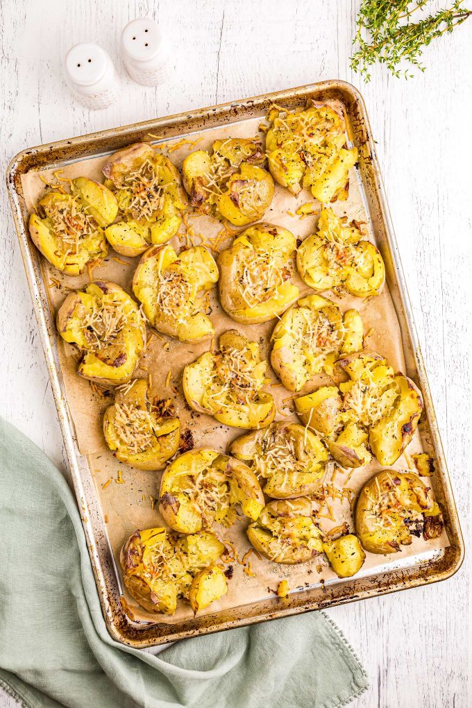 baking sheet full of baked smashed potatoes