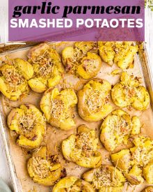 Crispy Smashed Potatoes are so fluffy on the inside, golden/crispy on the outside, and smothered in garlic and parmesan cheese!  The perfect family-pleasing side dish to serve with dinner. #potatoes #smashed #garlic #parmesan #sidedish #sidedishes #dinner