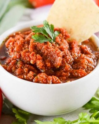 The best tomato salsa is made with fresh tomatoes, peppers, onion and more! A little spicy, slightly sweet, and perfect with salty chips. Great for Cinco de Mayo, potlucks, enchiladas and more!