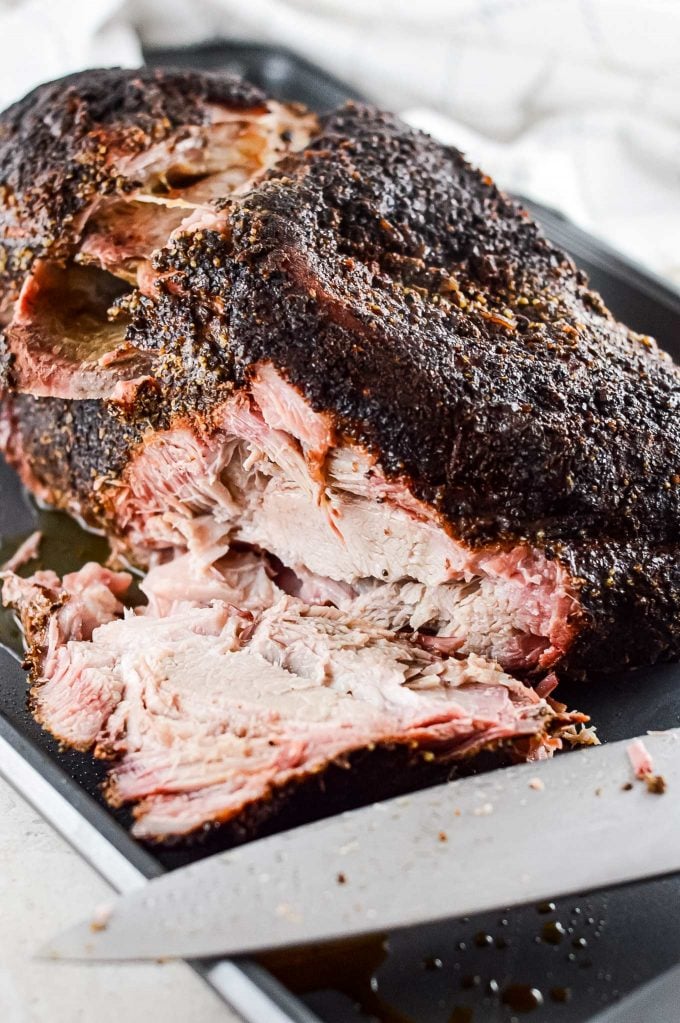 Ultra flavorful and tender, this Pork Shoulder is smoked low and slow, and creates the most amazing, melt in your mouth pulled pork!  Step by step how to smoke pork shoulder recipe.