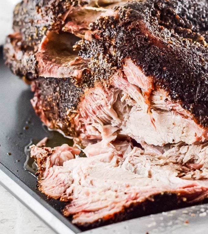 Ultra flavorful and tender, this Pork Shoulder is smoked low and slow, and creates the most amazing, melt in your mouth pulled pork!ย Step by step how to smoke pork shoulder recipe.