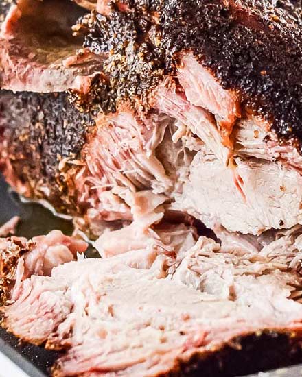 Ultra flavorful and tender, this Pork Shoulder is smoked low and slow, and creates the most amazing, melt in your mouth pulled pork!  Step by step how to smoke pork shoulder recipe.