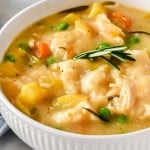 white bowl of chicken and dumplings