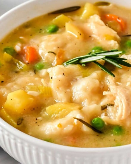 white bowl of chicken and dumplings
