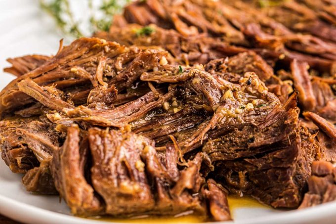 Juicy, melt-in-your-mouth beef, tender vegetables and an ultra flavorful gravy make for the perfect Pot Roast recipe! Classic comfort food meets family friendly dinner, made with the ease of the Instant Pot! #potroast #beef #instantpot #pressurecooker #dinner #comfortfood #potroastrecipe