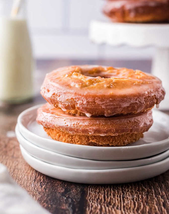 Two sour cream donuts on white plate