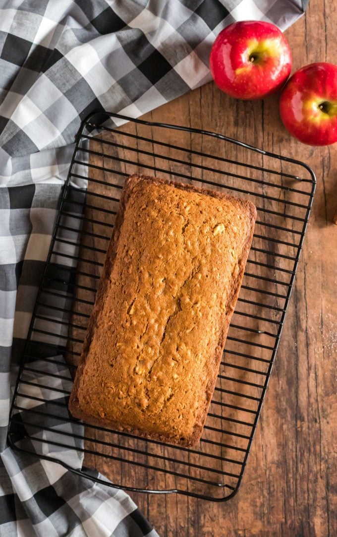 loaf of apple bread cooling on wire rack