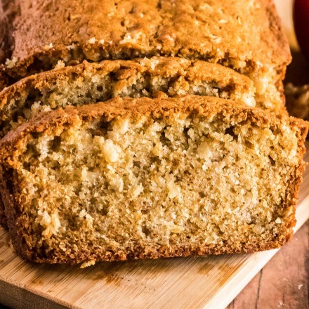 slices of cinnamon apple bread on wooden cutting board