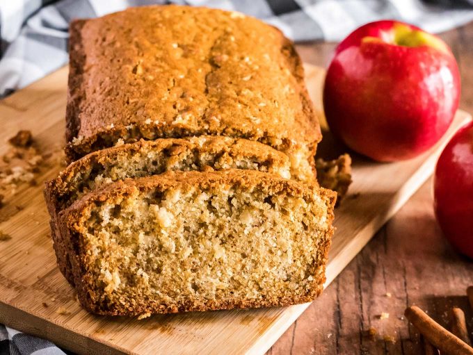 Loaf of apple cinnamon bread sliced on a cutting board