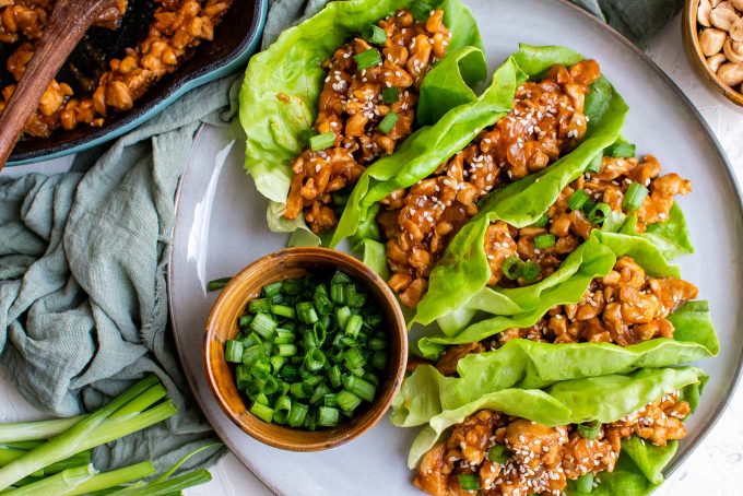 These easy Asian-Style Chicken Lettuce Wraps are SO flavorful, and perfect as a simple dinner recipe, or an appetizer for a party! #chicken #asian #chinese #lettucewraps #lettucecups #chickendinner #dinner #lunch #appetizer #party