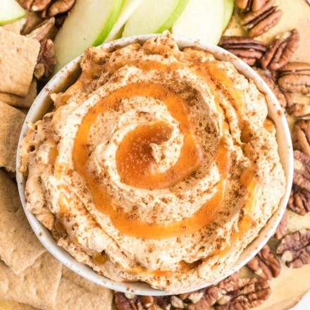 bowl of pumpkin dip surrounded by dippers