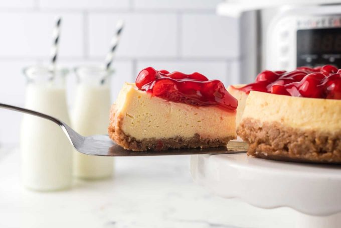removing a slice of instant pot cheesecake