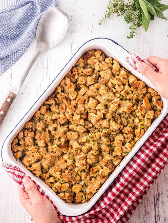 placing baking dish of stuffing on table
