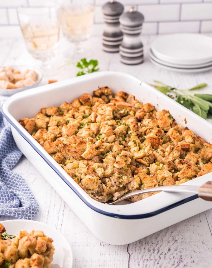 This Herb and Sausage Stuffing is a beloved classic side dish for Thanksgiving or Christmas!  Made with soft bread, tender vegetables and crumbled sausage, this moist and ultra flavorful stuffing is exactly what your holiday feast needs! #stuffing #dressing #holiday #sidedish #side #thanksgiving #christmas #feast