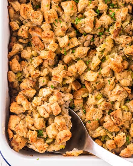 This Herb and Sausage Stuffing is a beloved classic side dish for Thanksgiving or Christmas!  Made with soft bread, tender vegetables and crumbled sausage, this moist and ultra flavorful stuffing is exactly what your holiday feast needs! #stuffing #dressing #holiday #sidedish #side #thanksgiving #christmas #feast