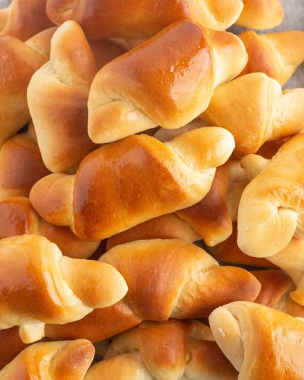 Buttery, soft and flaky, these Homemade Crescent Rolls are easier to make than you think! Perfect rolls for Thanksgiving or a family dinner! #crescentrolls #crescents #dinnerrolls #rolls #thanksgiving #bread #homemaderecipe #yeast