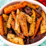 white bowl with roasted carrots inside