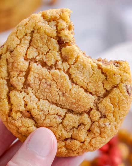 These chewy pumpkin cookies are studded with bits of toffee and caramel, and baked until soft and tender.  The perfect Fall dessert, these cookies go great with a cold glass of milk! #cookies #pumpkin #baking #caramel #toffee #dessert