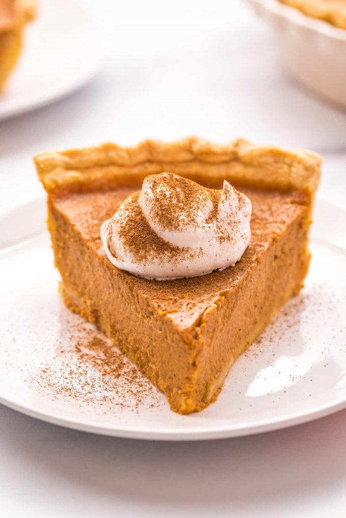 My Classic Pumpkin Pie is velvety smooth and creamy, perfectly spiced, and so easy to make!  The perfect dessert for the holidays, and the only pumpkin pie recipe you'll need. #pumpkin #pumpkinpie #pie #dessert #baking #fromscratch #libby #thanksgiving #holidays