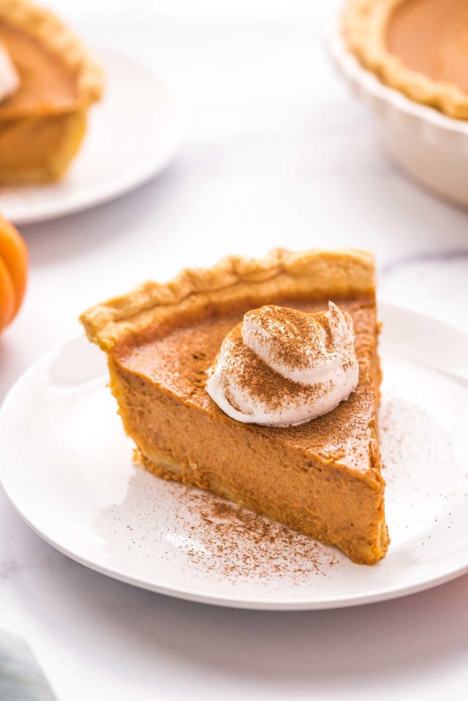 My Classic Pumpkin Pie is velvety smooth and creamy, perfectly spiced, and so easy to make!  The perfect dessert for the holidays, and the only pumpkin pie recipe you'll need. #pumpkin #pumpkinpie #pie #dessert #baking #fromscratch #libby #thanksgiving #holidays