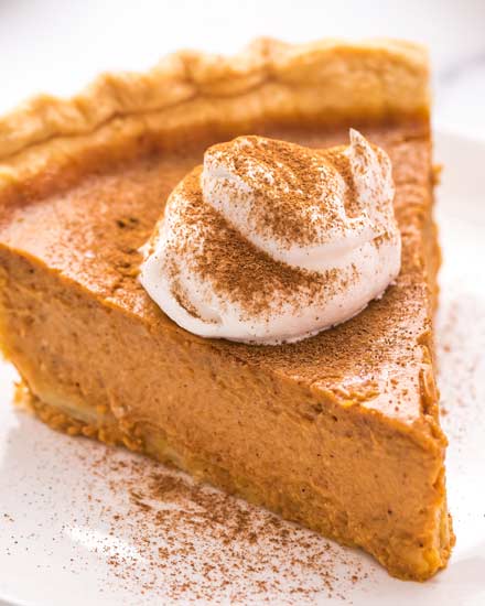 My Classic Pumpkin Pie is velvety smooth and creamy, perfectly spiced, and so easy to make!  The perfect dessert for the holidays, and the only pumpkin pie recipe you'll need. #pumpkin #pumpkinpie #pie #dessert #baking #fromscratch #libby #thanksgiving #holidays