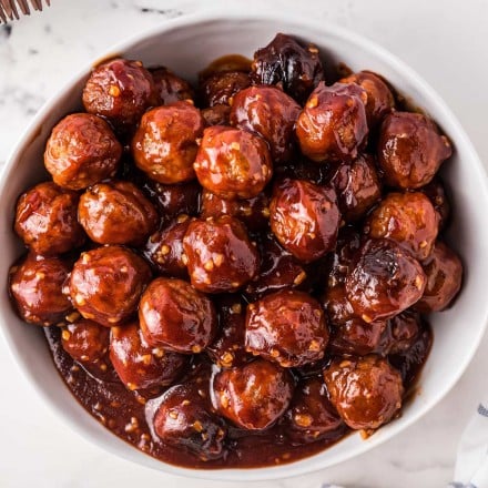 bowl of honey garlic crockpot meatballs in sauce