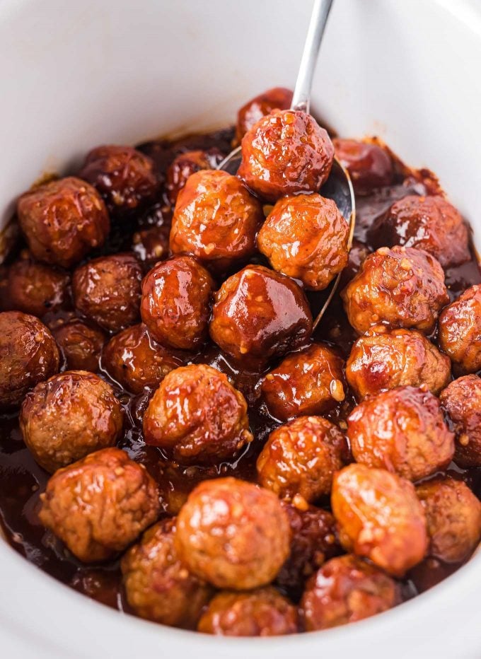 spoonful of meatballs in crockpot